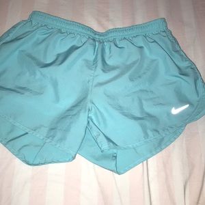 Teal Nike running shorts